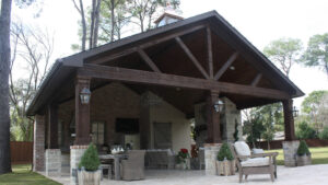 Stained Cedar Beams on a Cabana with an Outdoor Kitchen