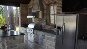 A Full Outdoor Kitchen and full size Refrigerator in Hoston