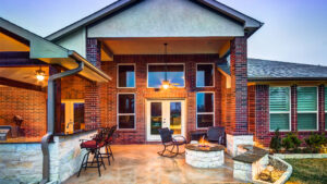 Attached Patio Cover with Outdoor Kitchen and Fire Pit in Houston
